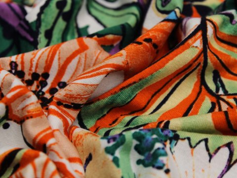 Dzianina jersey wzór kwiaty pomarańcz zieleń Dzianina jersey wzór kwiaty pomarańcz zieleń